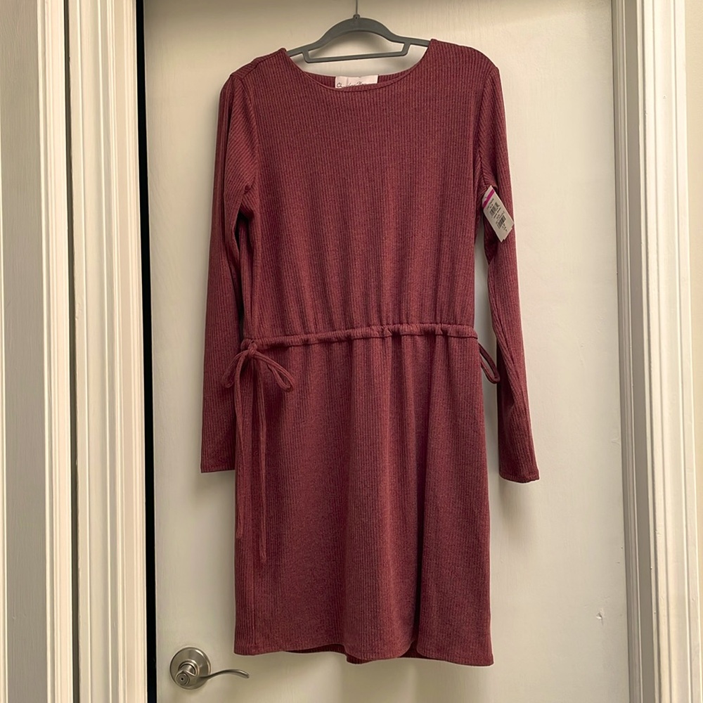 Charlene Henry Size Medium, mid length dress comes to just above the knee.